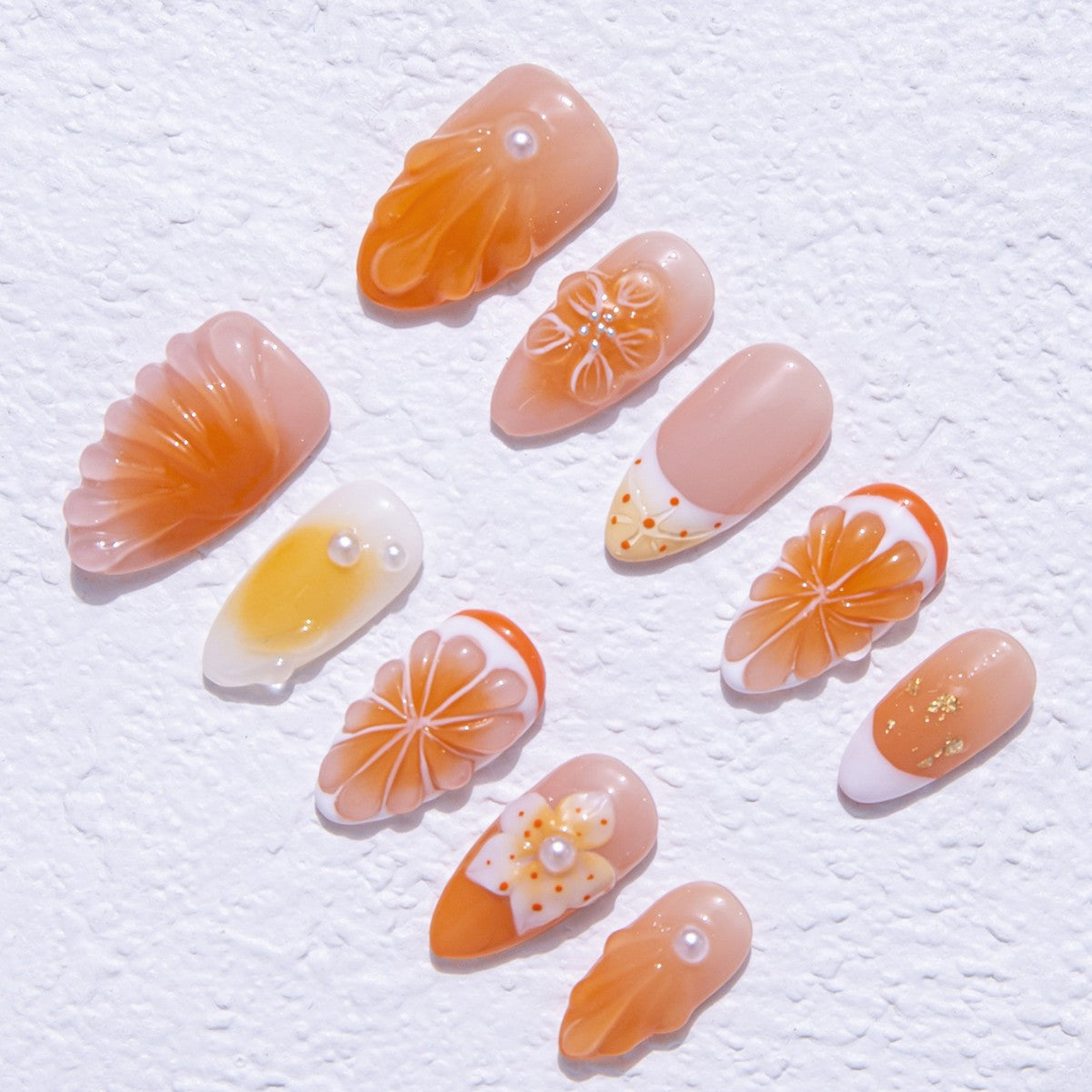 Why orange-colored nails are trending right now