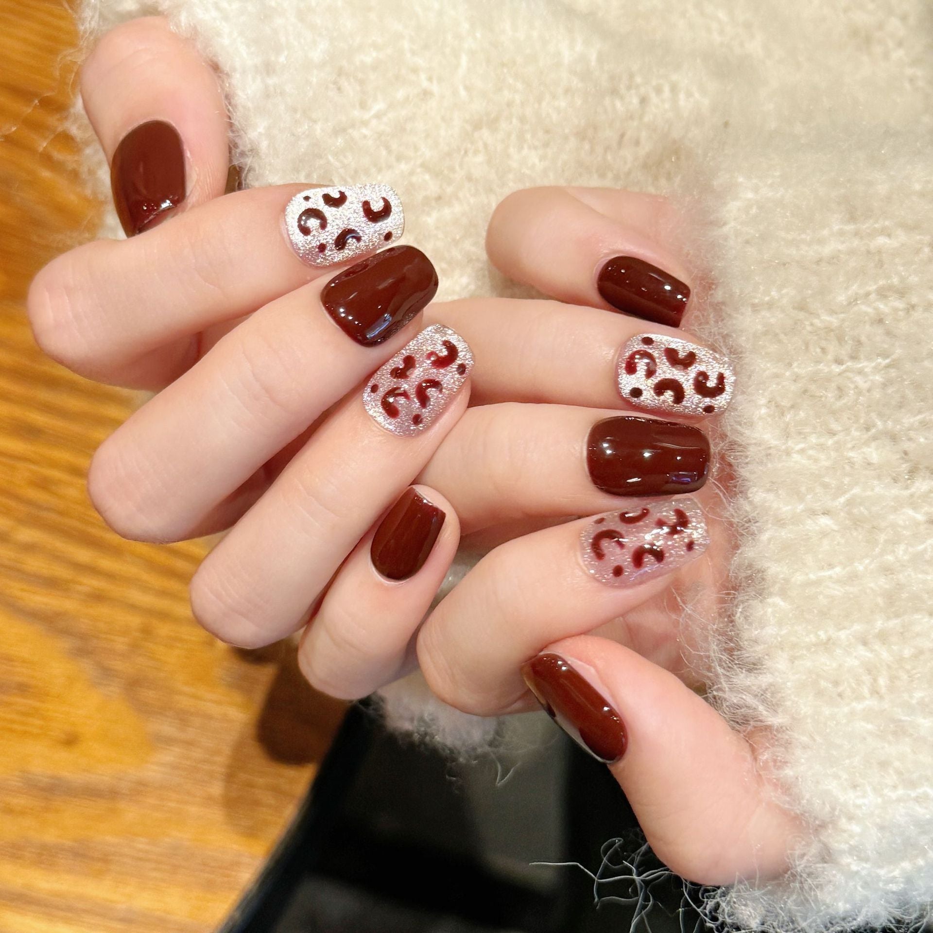 A fashionable party with deep red and silver glittering decorations and nail painting attire