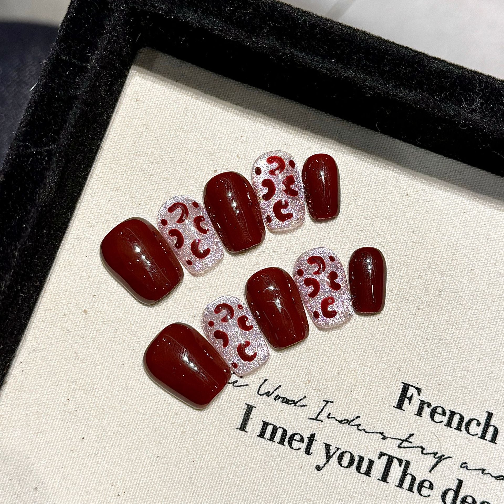 A fashionable party with deep red and silver glittering decorations and nail painting attire