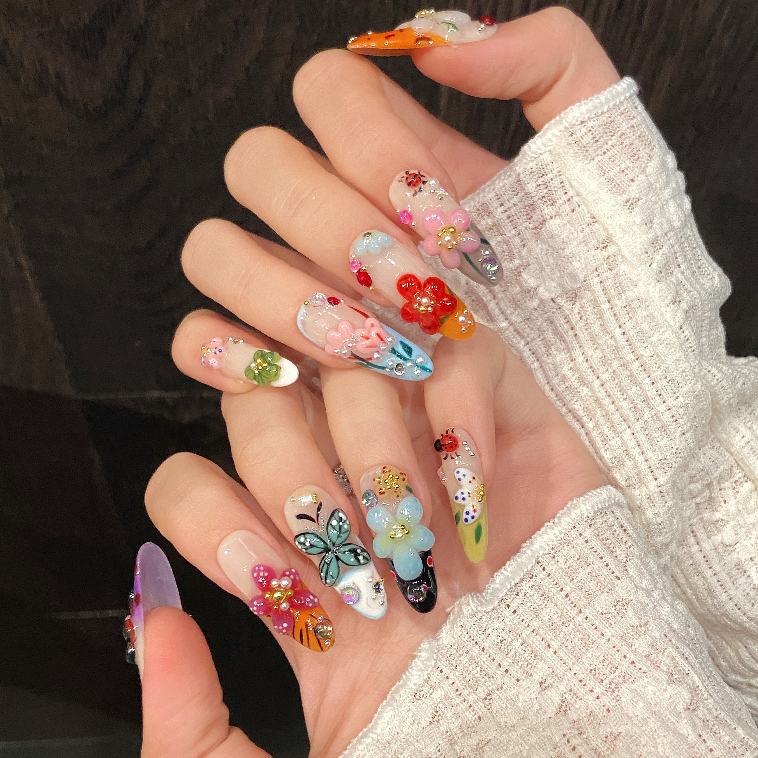 Summer floral nail art with almond-shaped nails